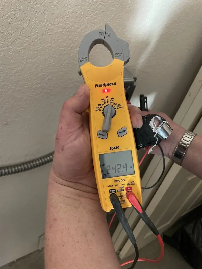 Voltage testing with clamp meter during Electrical Installation Services in North River Shores